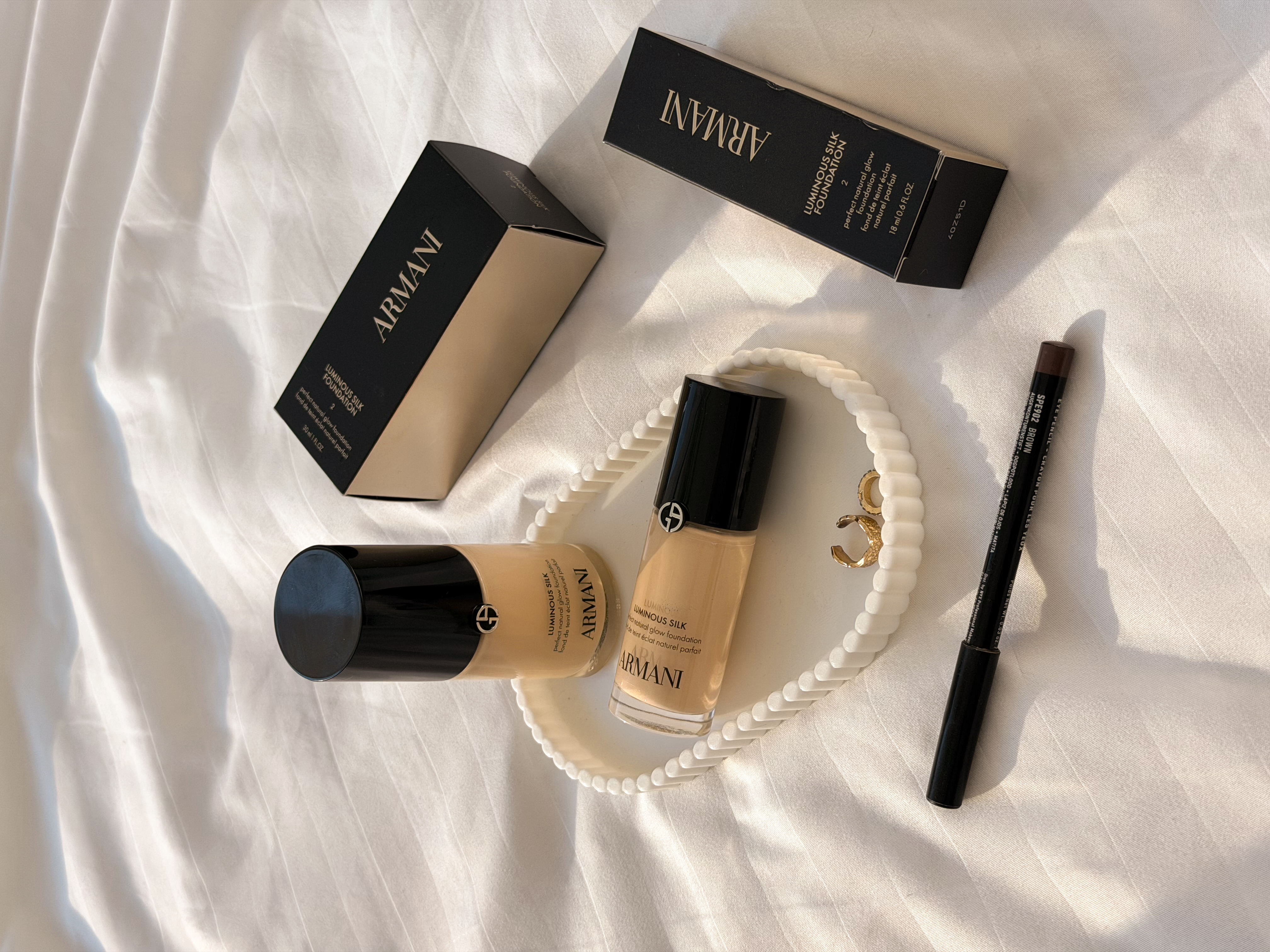 Armani beauty product flat lay
